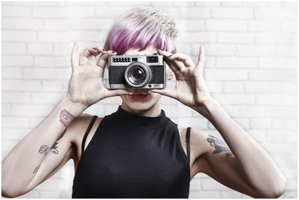 a woman holding a camera