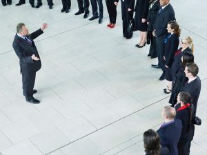 boss addressing a big group of employees