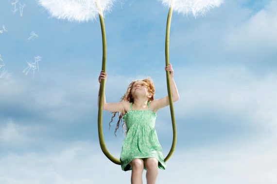 Little-girl-sitting-on-giant-Dandelion